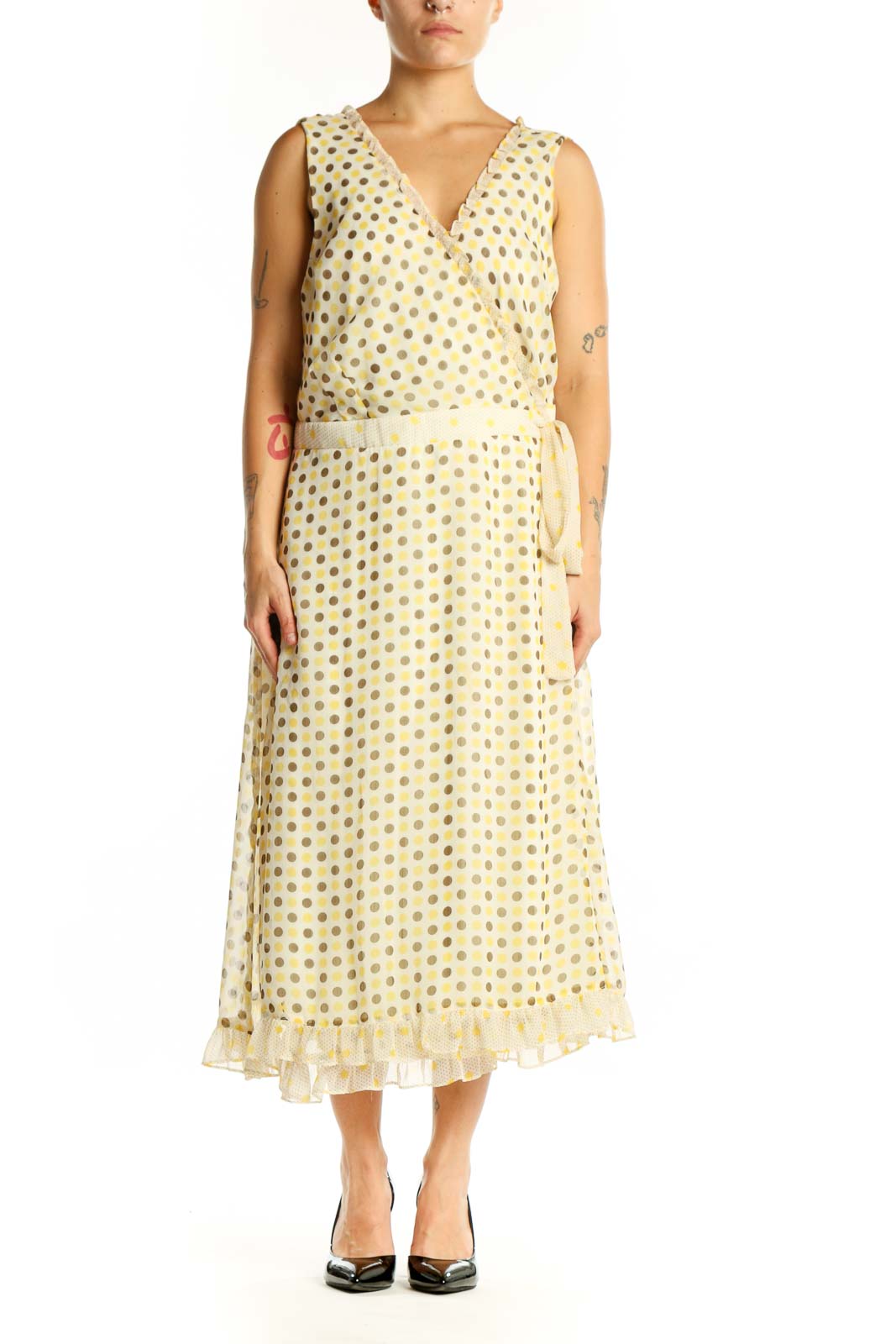 Front view of cream polka dot wrap midi dress with V-neckline and tie belt