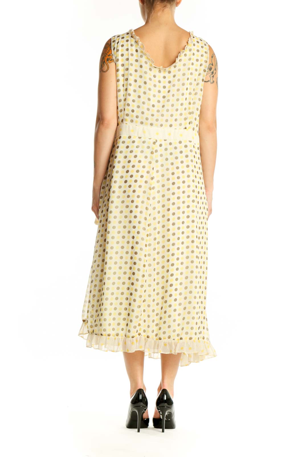 Back view of cream polka dot wrap midi dress showing pleated hem detail