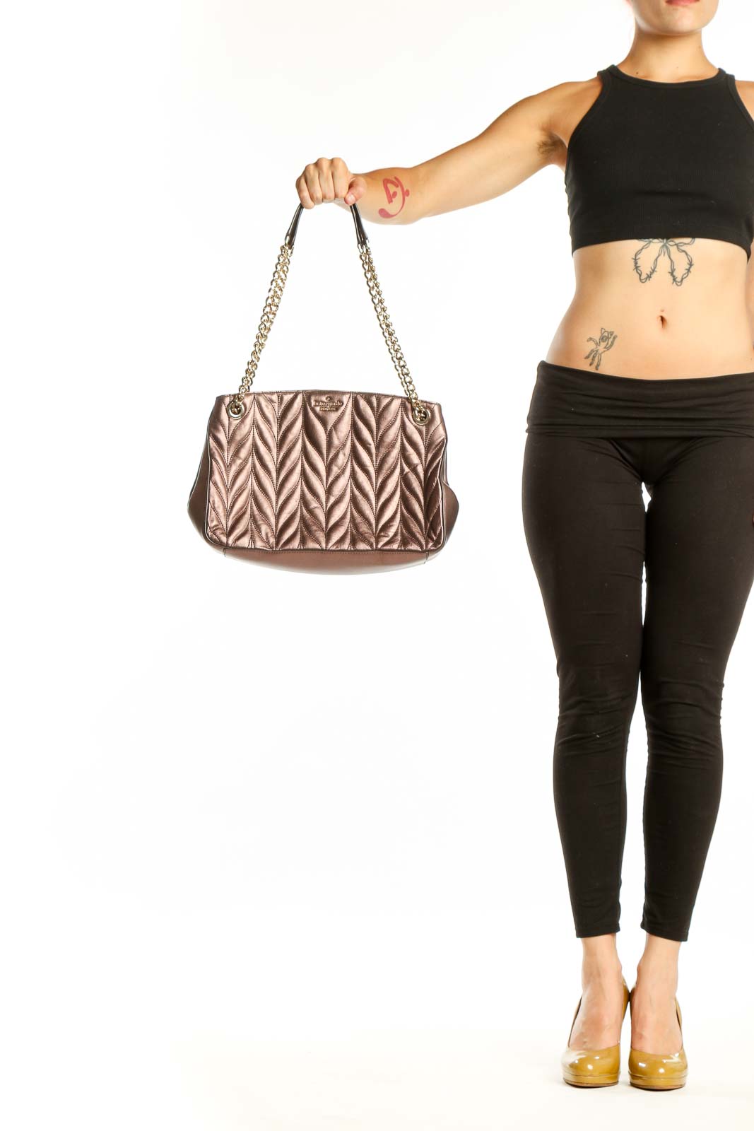 Rose gold quilted leather shoulder bag by Kate Spade with dual chain straps and chevron pattern, front view