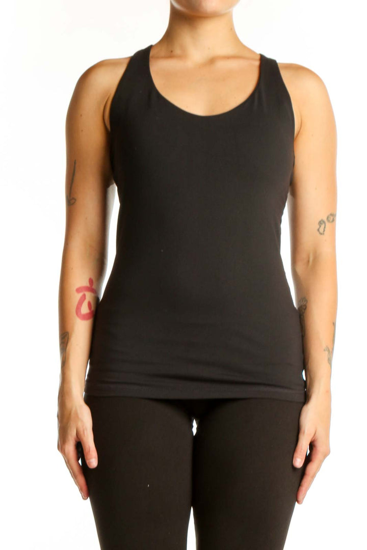 Black prAna racerback tank top front view on model, size M
