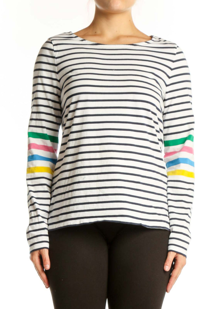 Navy and white striped long sleeve cotton top with colorful rainbow stripes on sleeves, front view