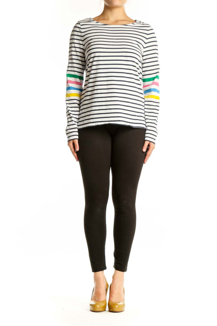 Navy and white striped long sleeve cotton top with colorful rainbow stripes on sleeves, front view