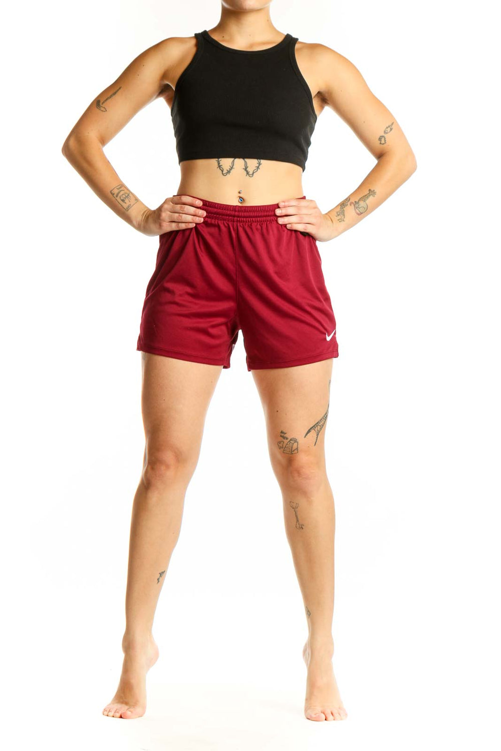 Burgundy Nike athletic shorts front view with elastic waistband and Swoosh logo