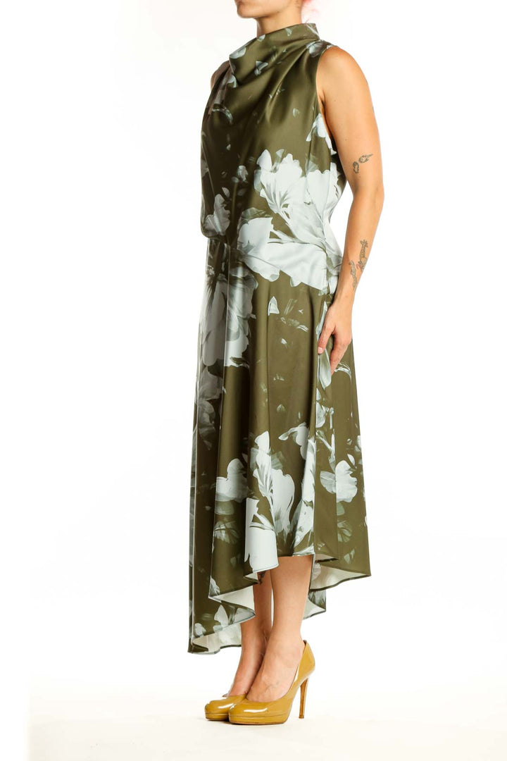 Olive green floral dress with white botanical print, cowl neckline, and asymmetrical hemline by Donna Karan New York
