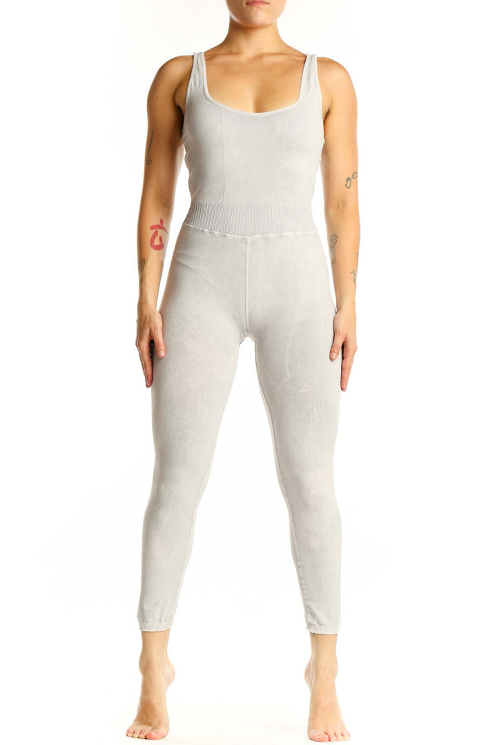 Front view of cream ribbed tank all-in-one jumpsuit with scoop neckline and cropped leggings