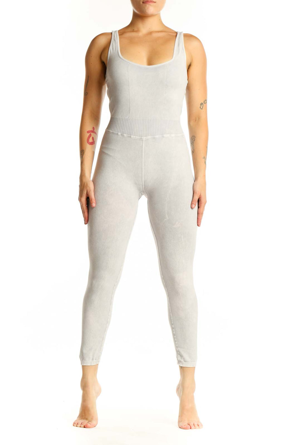 Front view of cream ribbed tank all-in-one jumpsuit with scoop neckline and cropped leggings