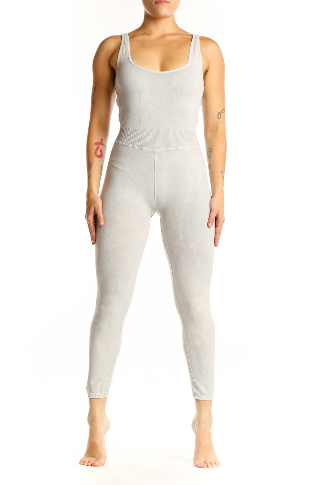 Front view of cream ribbed tank all-in-one jumpsuit with scoop neckline and cropped leggings