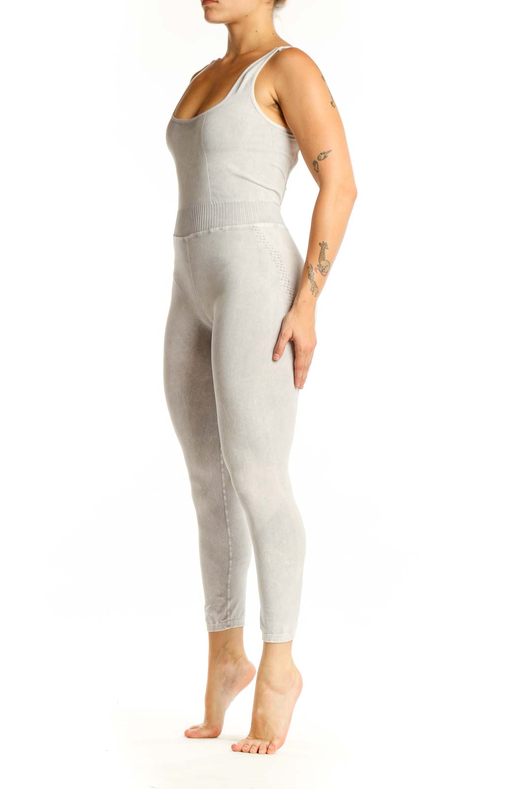 Front view of cream ribbed tank all-in-one jumpsuit with scoop neckline and cropped leggings