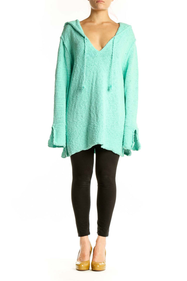 Front view of mint green hooded V-neck knit sweater with textured fabric and oversized fit