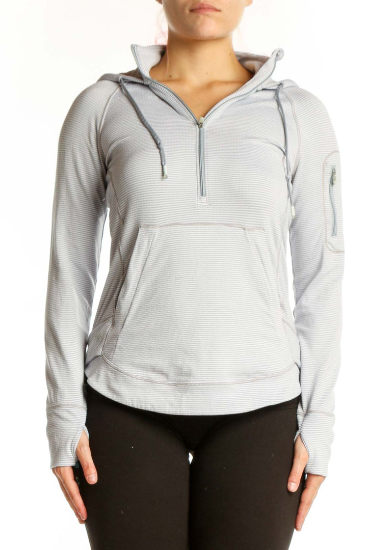 Gray and white striped Athleta hooded pullover with quarter-zip front view