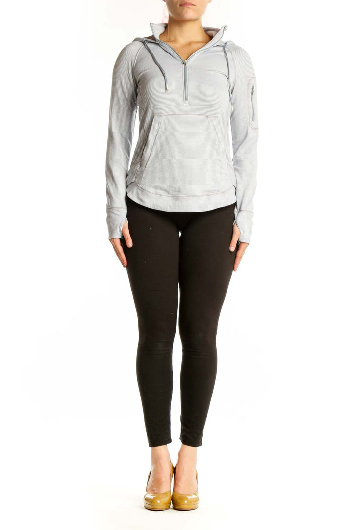 Gray and white striped Athleta hooded pullover with quarter-zip front view