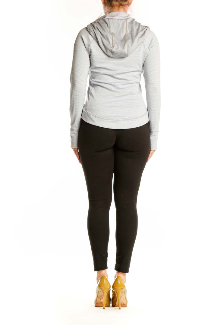 Gray and white striped Athleta hooded pullover back view showing fitted silhouette
