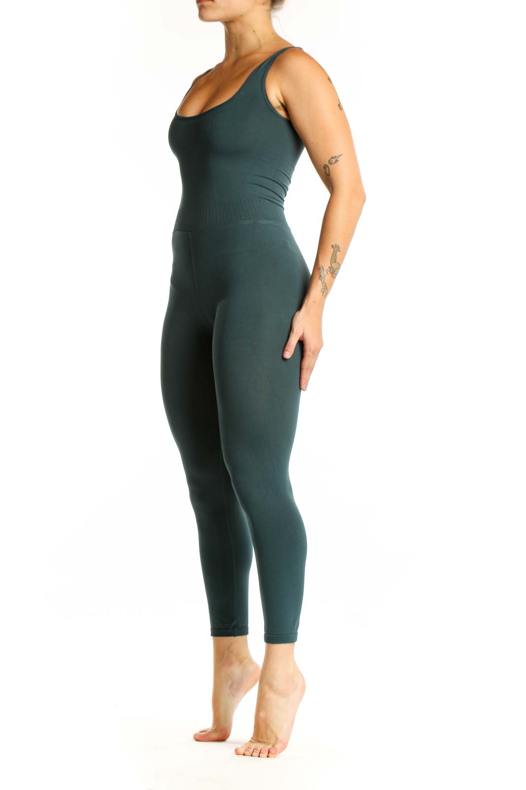 Front view of teal ribbed tank all-in-one jumpsuit with scoop neckline and fitted high-waisted leggings