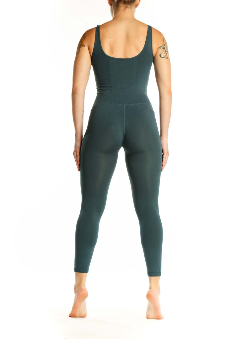 Back view of teal ribbed tank all-in-one jumpsuit showing sleek silhouette and full-length legging design