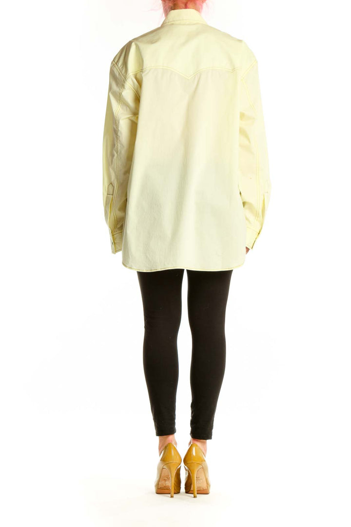 Cream cotton button-up shirt back view showing full length and relaxed silhouette