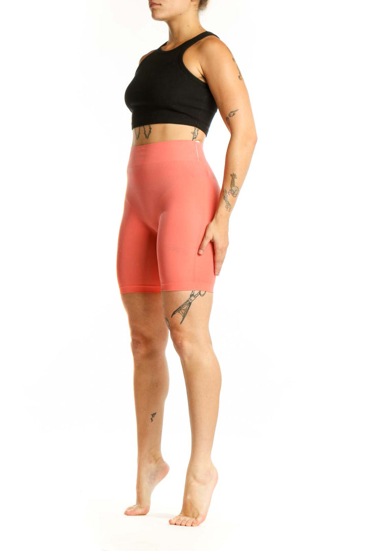 Coral high-waist biker shorts front view, Intimately Free People activewear