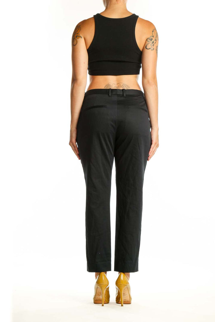 Black cropped dress pants from Allsaints, back view displaying the tailored fit and refined construction of the premium fabric