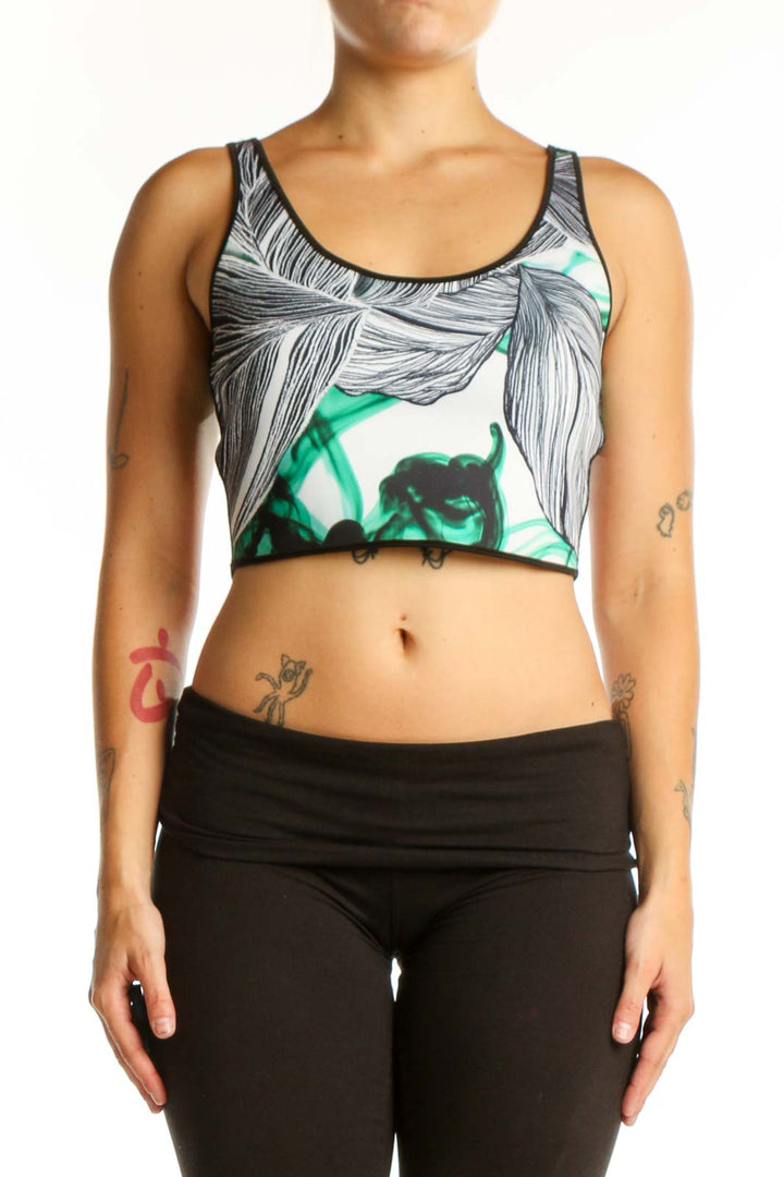 White and green floral botanical print sports bra tank top with racerback straps, front view