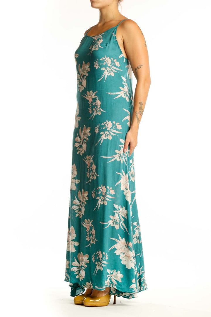 Teal rayon maxi dress with cream floral botanical prints, spaghetti straps, front view