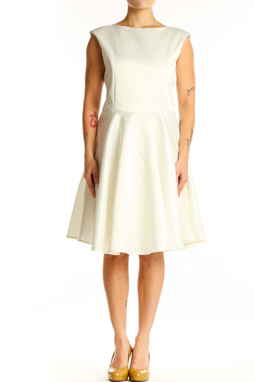 Front view of cream sleeveless A-line midi dress with crew neckline and flowing skirt