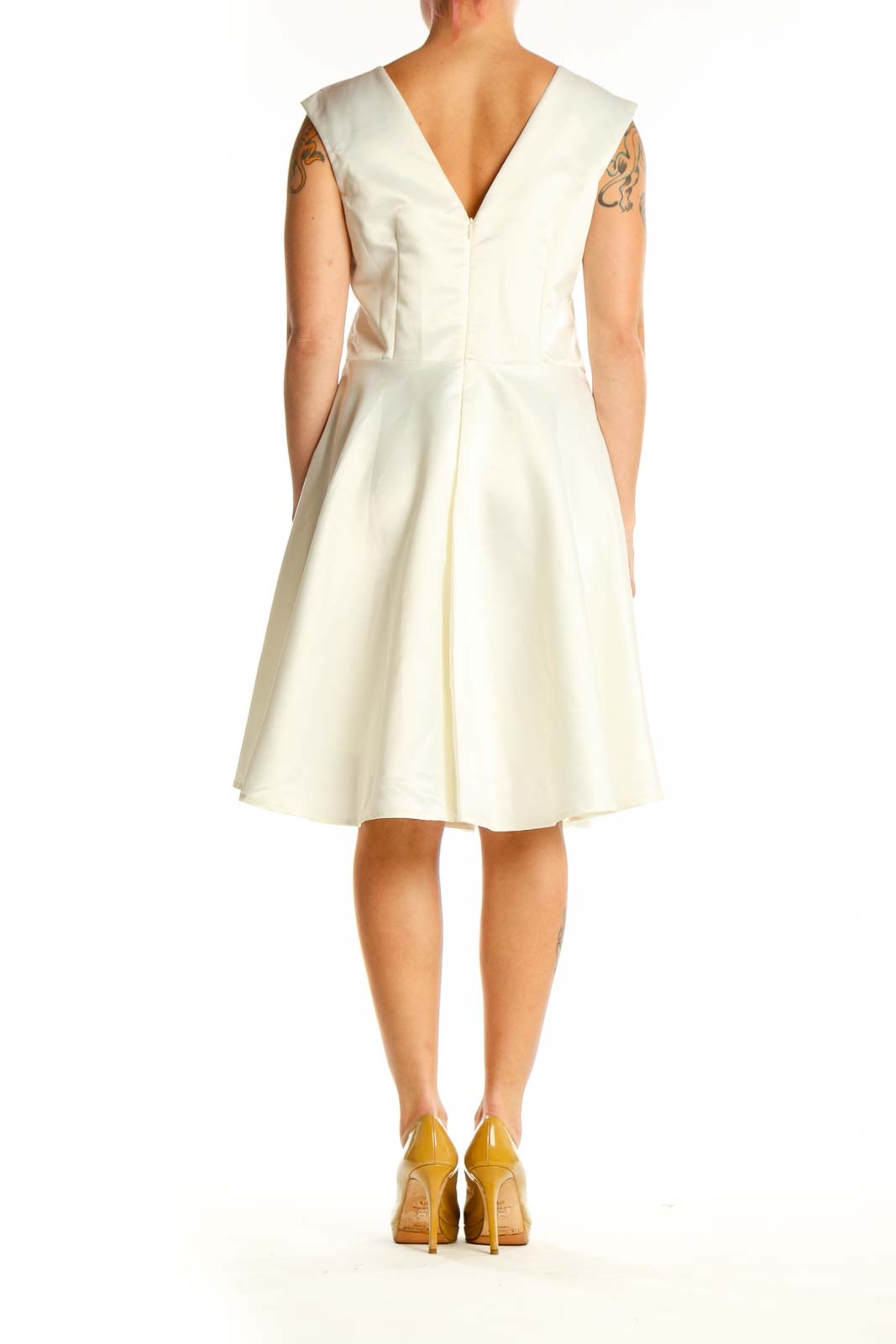 Back view of cream sleeveless A-line midi dress showing elegant drape and silhouette