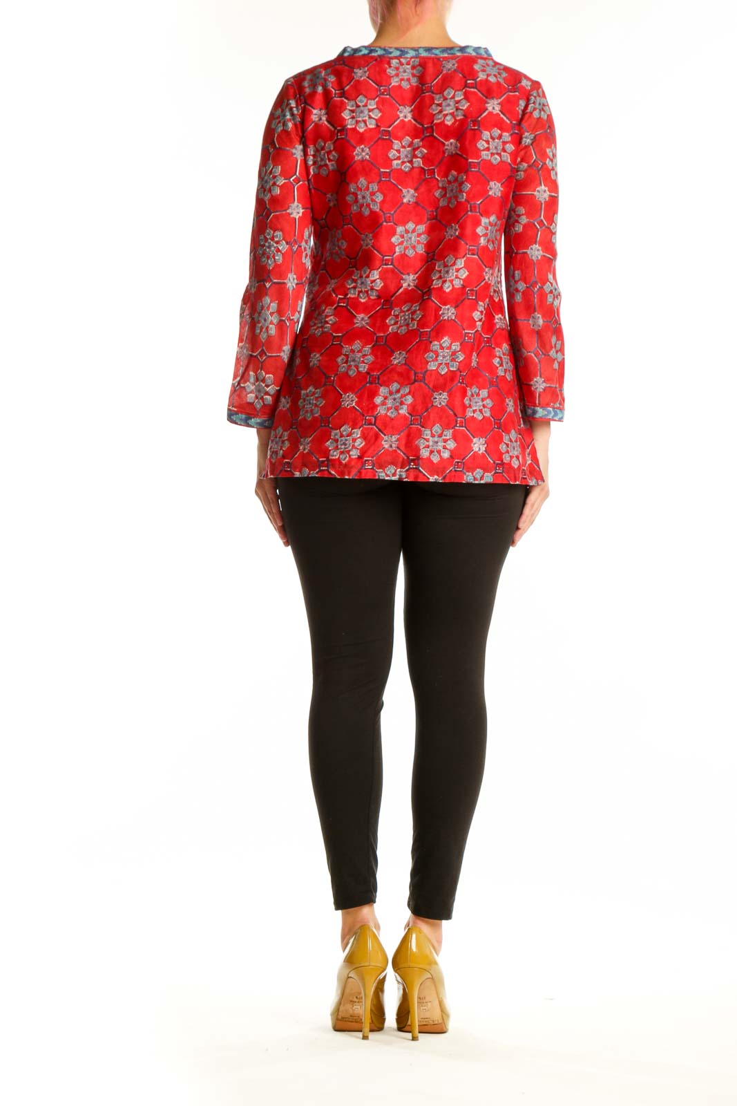 Red floral tunic top with contrasting blue trim and three-quarter bell sleeves, back view