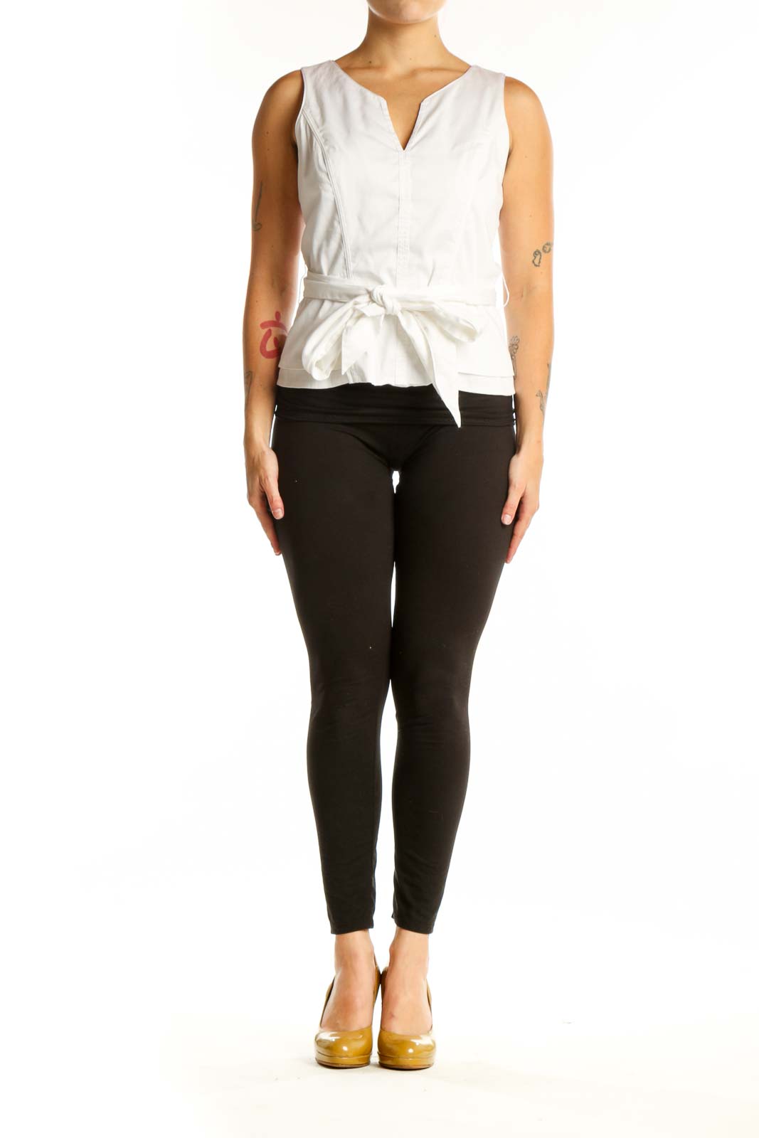 White House Black Market white sleeveless tie-front top with V-neckline and adjustable waist tie, front view on model