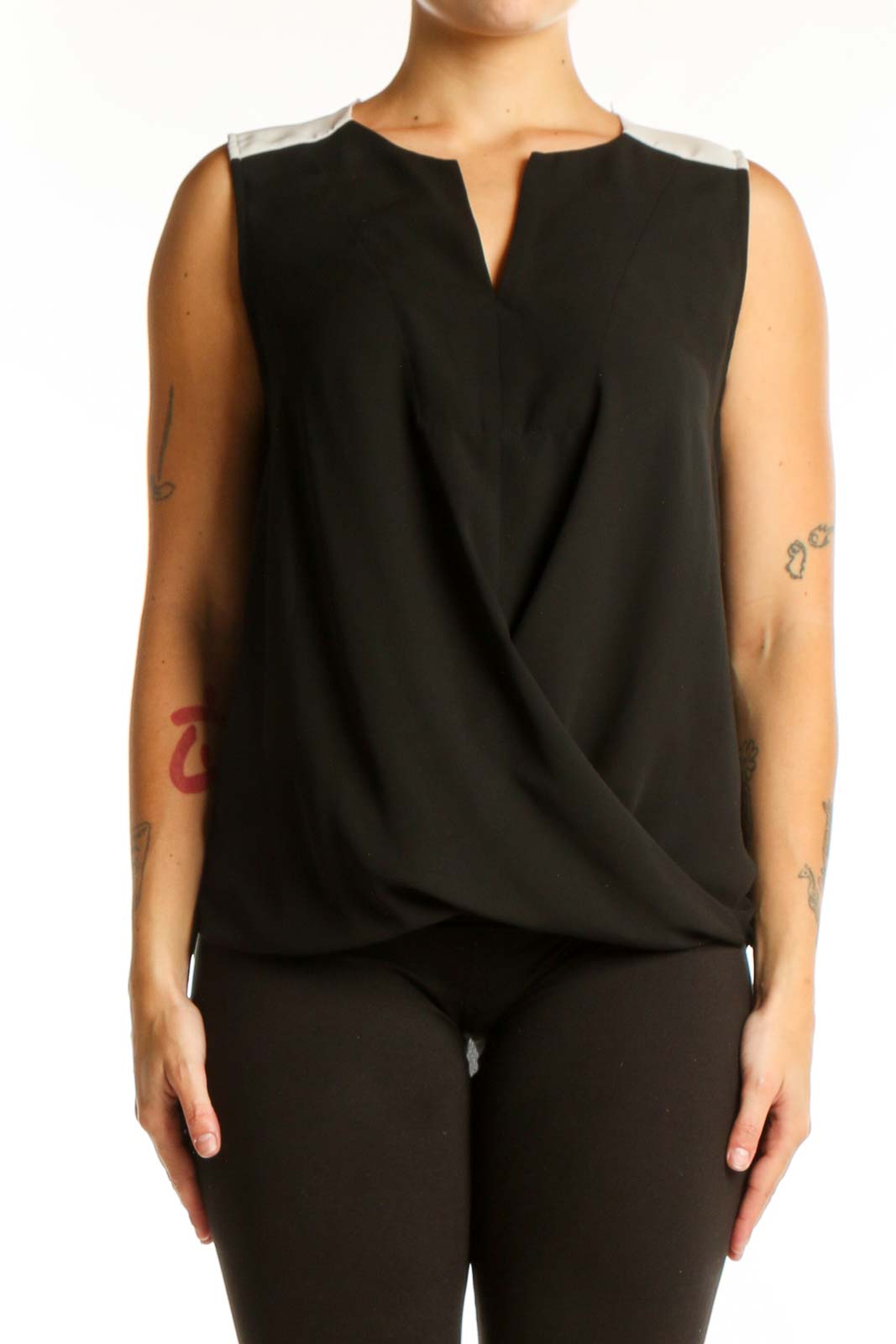 Black wrap sleeveless top with keyhole neckline and wrap-front design, front view