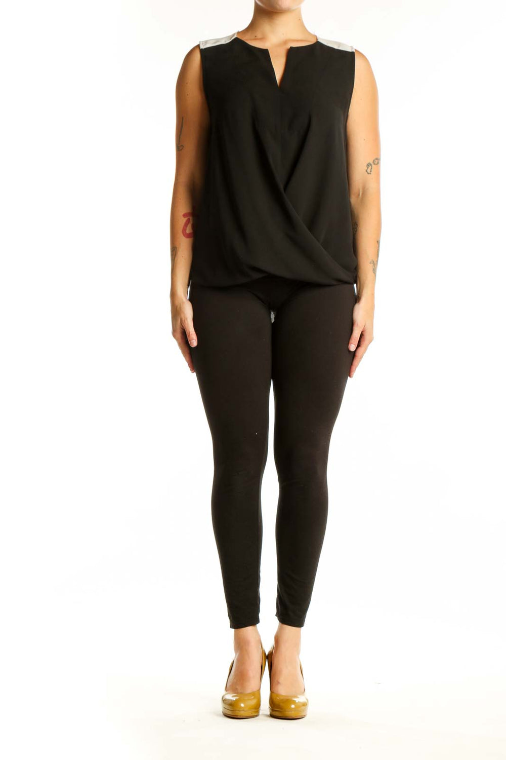 Black wrap sleeveless top with keyhole neckline and wrap-front design, front view