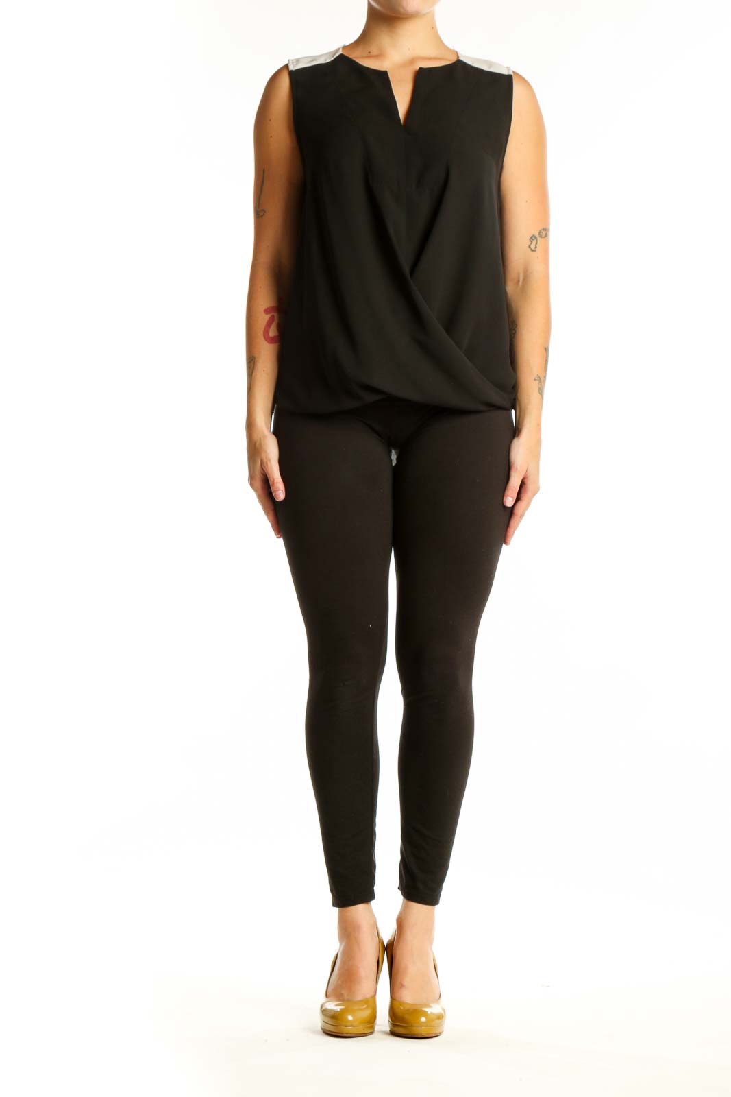 Black wrap sleeveless top with keyhole neckline and wrap-front design, front view