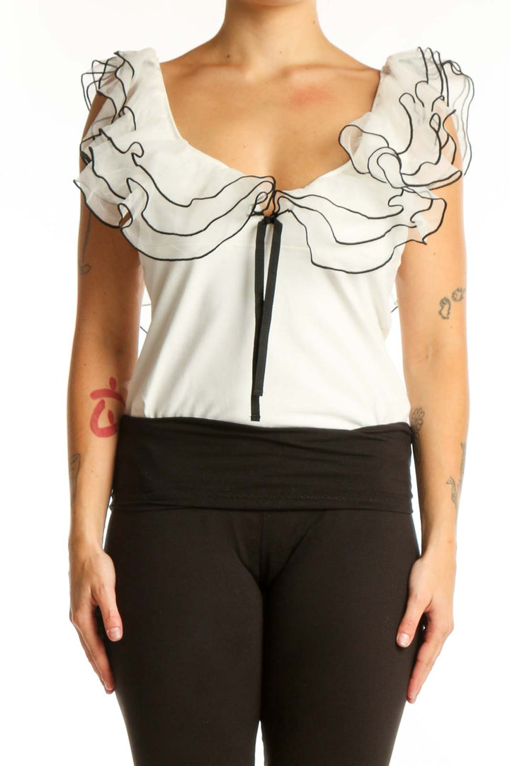 Cream ruffled off-shoulder crop top with black line detailing and tie front closure