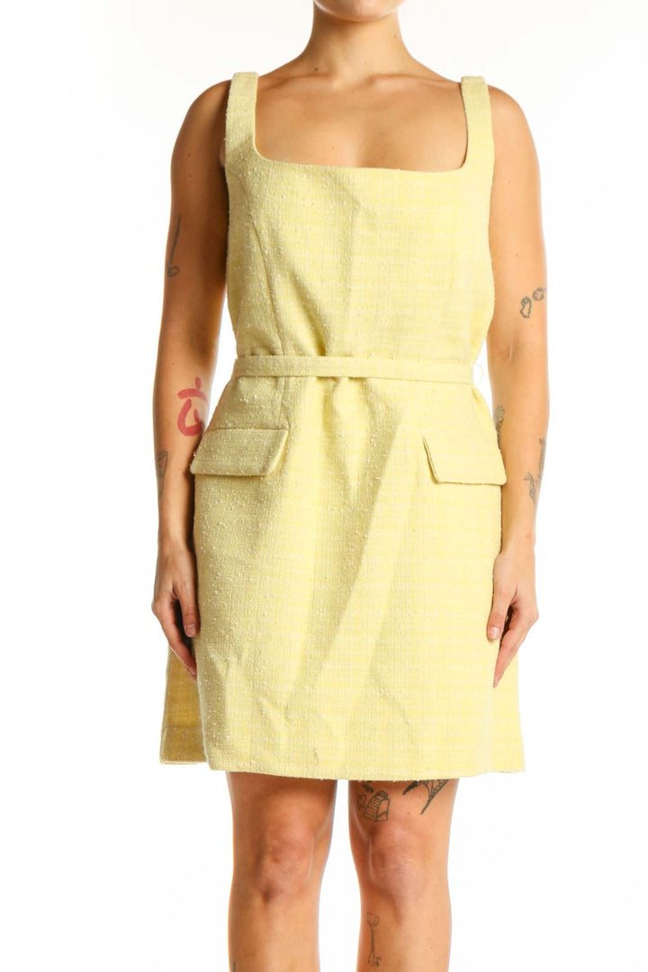 Yellow square neck sleeveless dress with patch pockets and cinched waist, front view