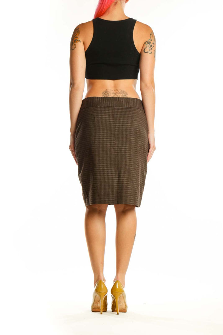 Brown quilted pencil skirt with ribbed waistband, back view on model