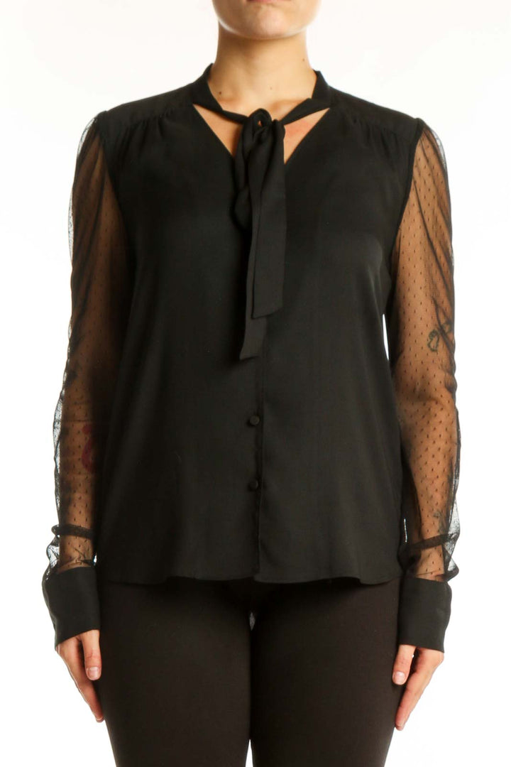 Black Ann Taylor blouse with lace sleeves and tie-neck detail, front view