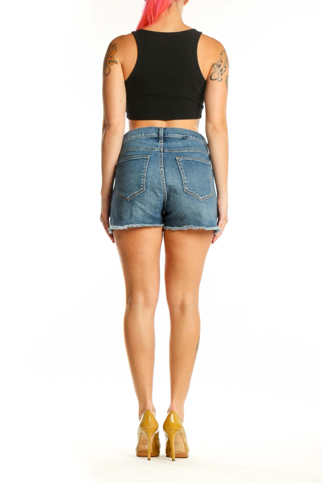 Back view of blue denim cut-off shorts showing distressed cut-off hem and fit