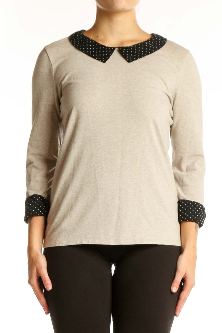 Cream long sleeve top with black polka dot Peter Pan collar and cuffs, front view
