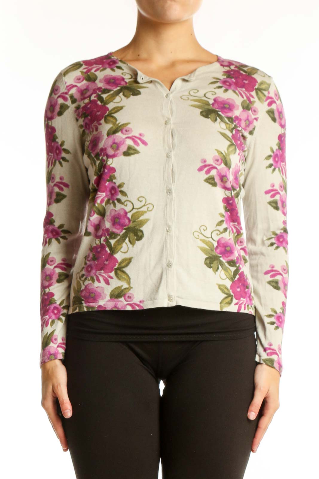 Cream cardigan with pink floral print, button-front closure, cropped silhouette, worn with black pants