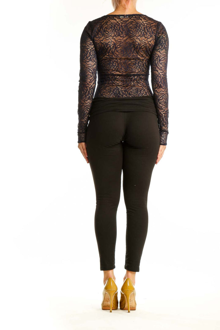 Black floral lace long sleeve crop top, back view showing sheer lace design