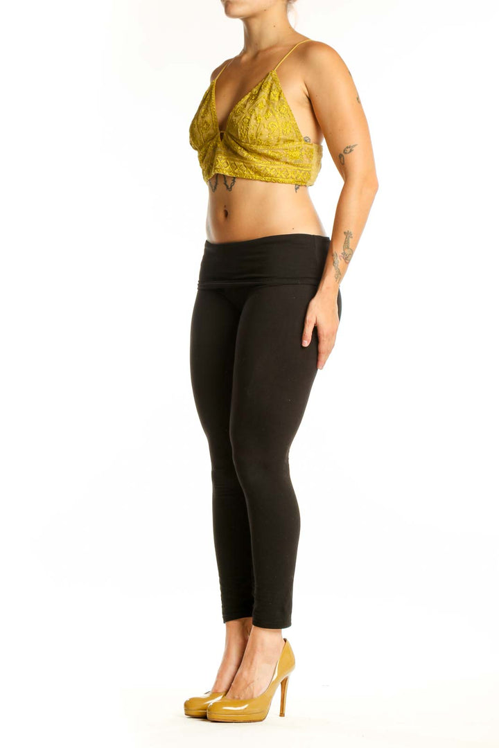 Yellow lace wrap crop top with adjustable spaghetti straps and V-neckline, front view