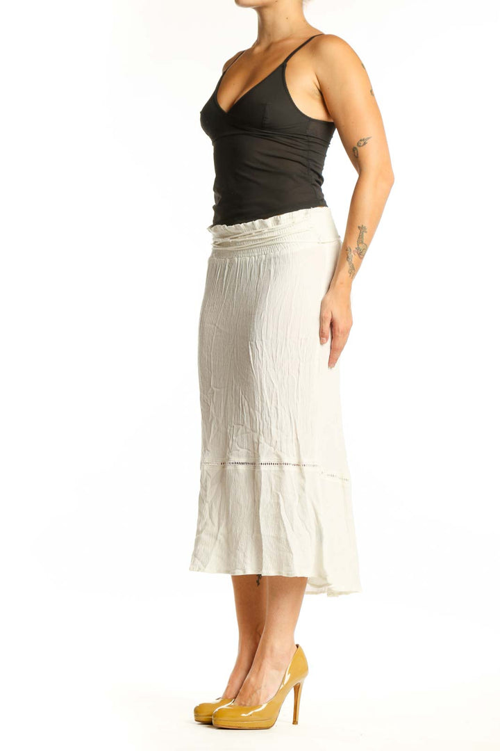 Cream pleated rayon midi skirt front view with decorative waistband and flowing silhouette