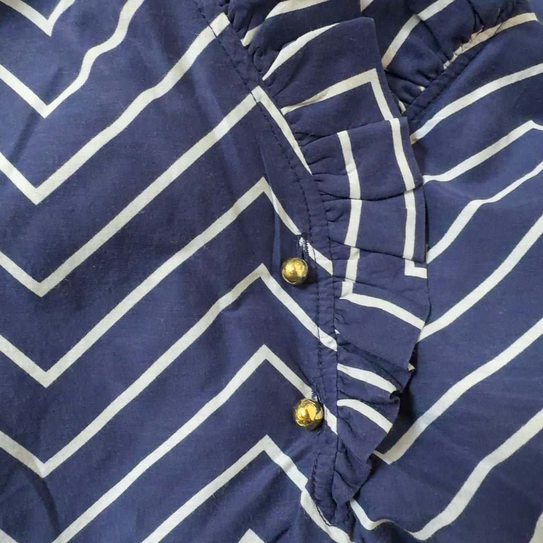 Navy and white chevron striped short sleeve top with puffed sleeves, back view