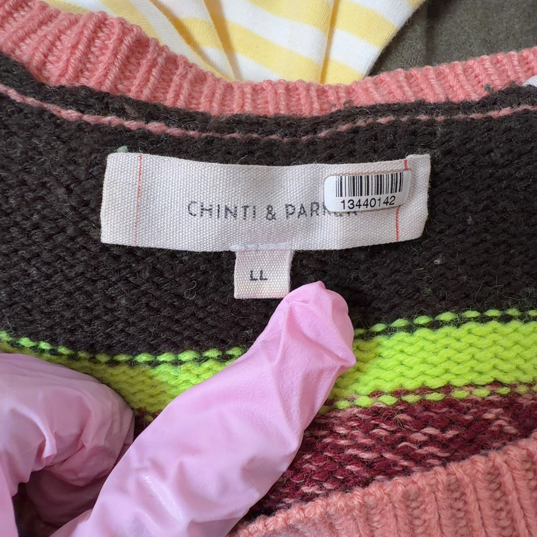Tag view of multicolor striped cashmere wool pullover showing horizontal stripe pattern and relaxed cropped fit