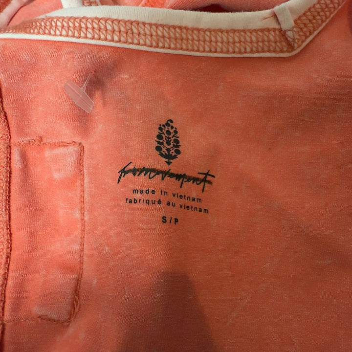 Coral henley tank top with white contrast trim, back view showing fitted silhouette