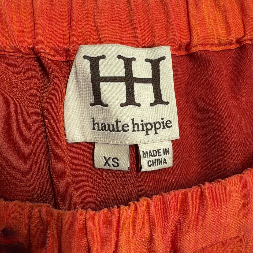 Red ombré silk shorts with drawstring waist, back view on model