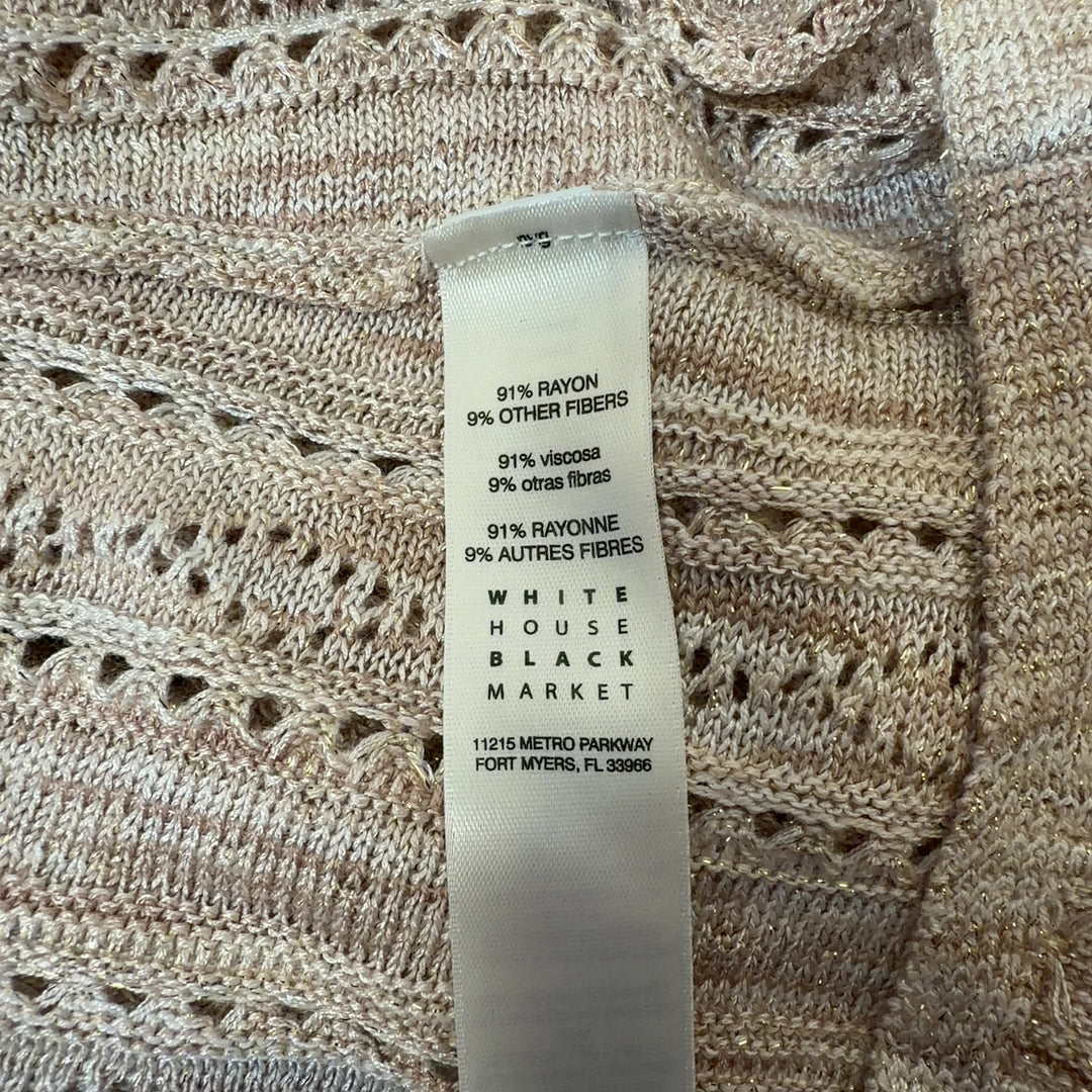 Cream ruffled v-neck knit top with eyelet detailing and flutter sleeves, back view