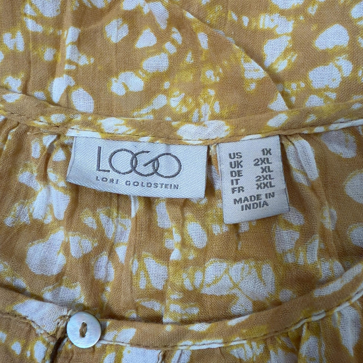 Yellow floral print cotton blouse with bell sleeves and coral trim detail, back view