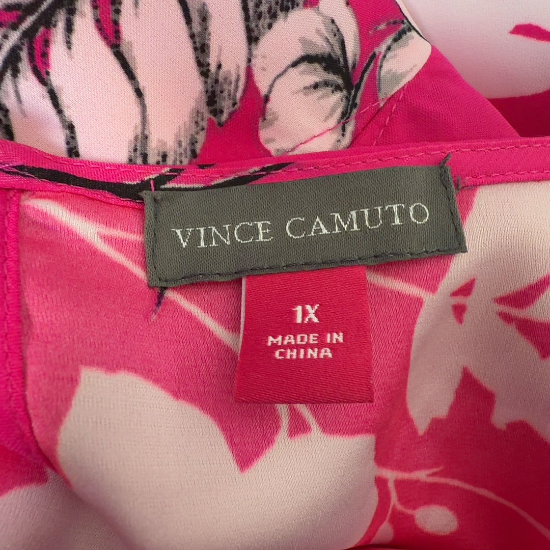 Tag view of pink floral hi-low blouse showing flowing hemline and botanical print design