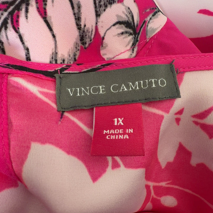 Tag view of pink floral hi-low blouse showing flowing hemline and botanical print design