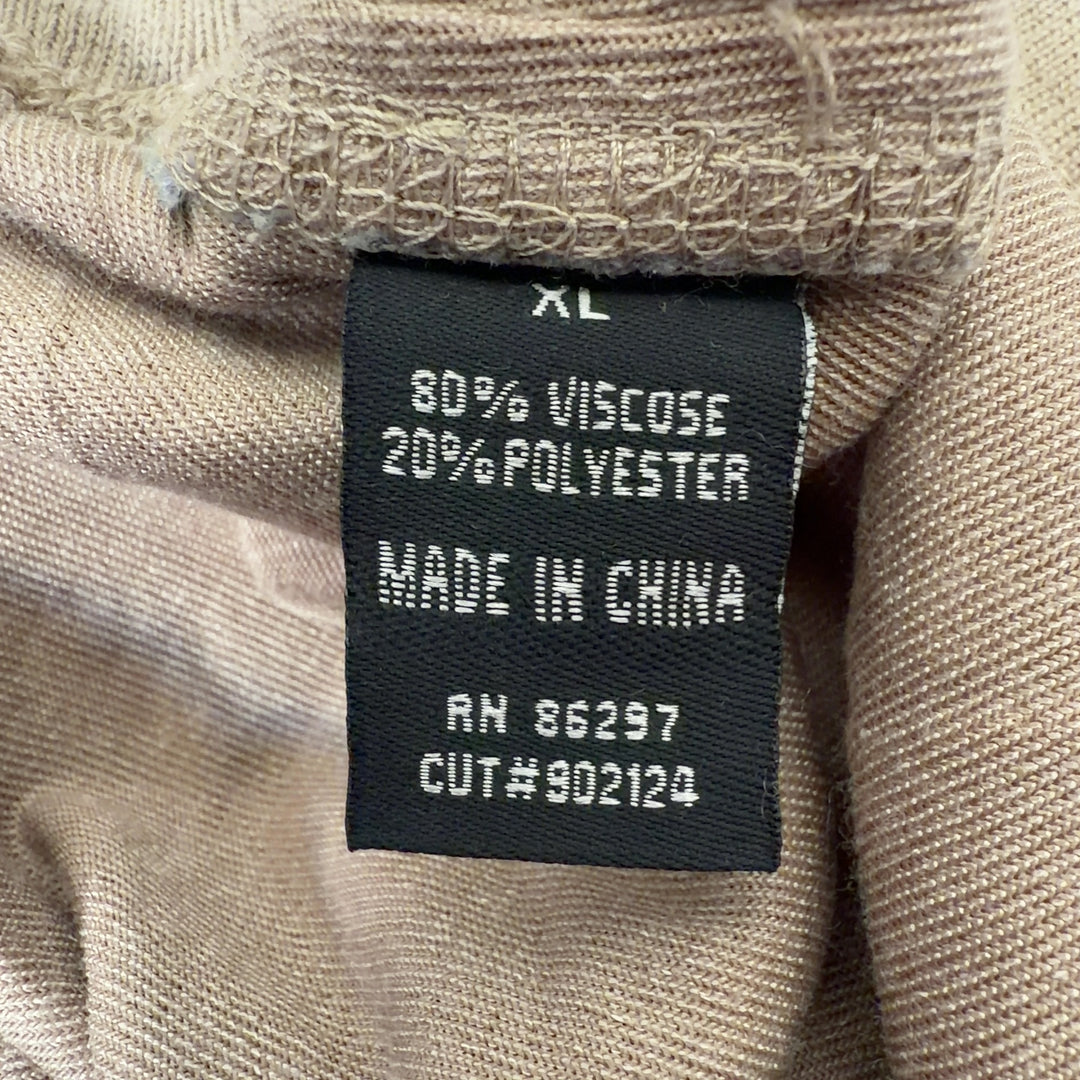 Tag view of cream velvet cropped jogger pants showing relaxed fit and ankle length by BCBG MaxAzria