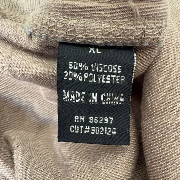 Tag view of cream velvet cropped jogger pants showing relaxed fit and ankle length by BCBG MaxAzria